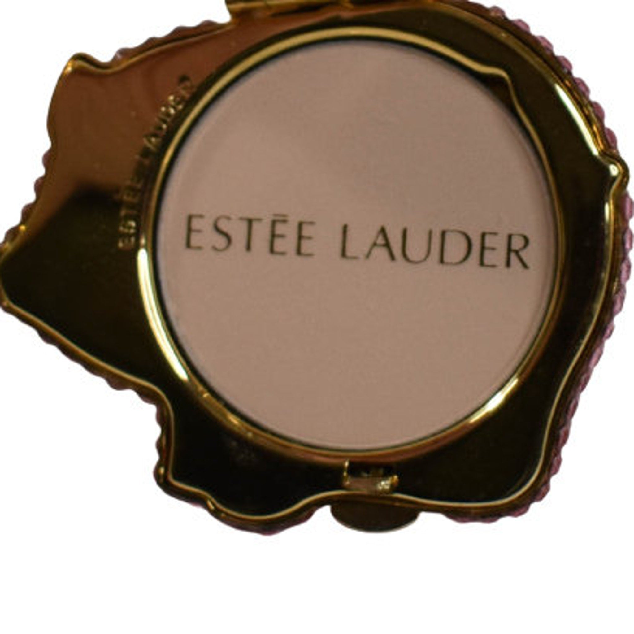 Estee Lauder compact powder with gold frame and pink gems, brand logo visible