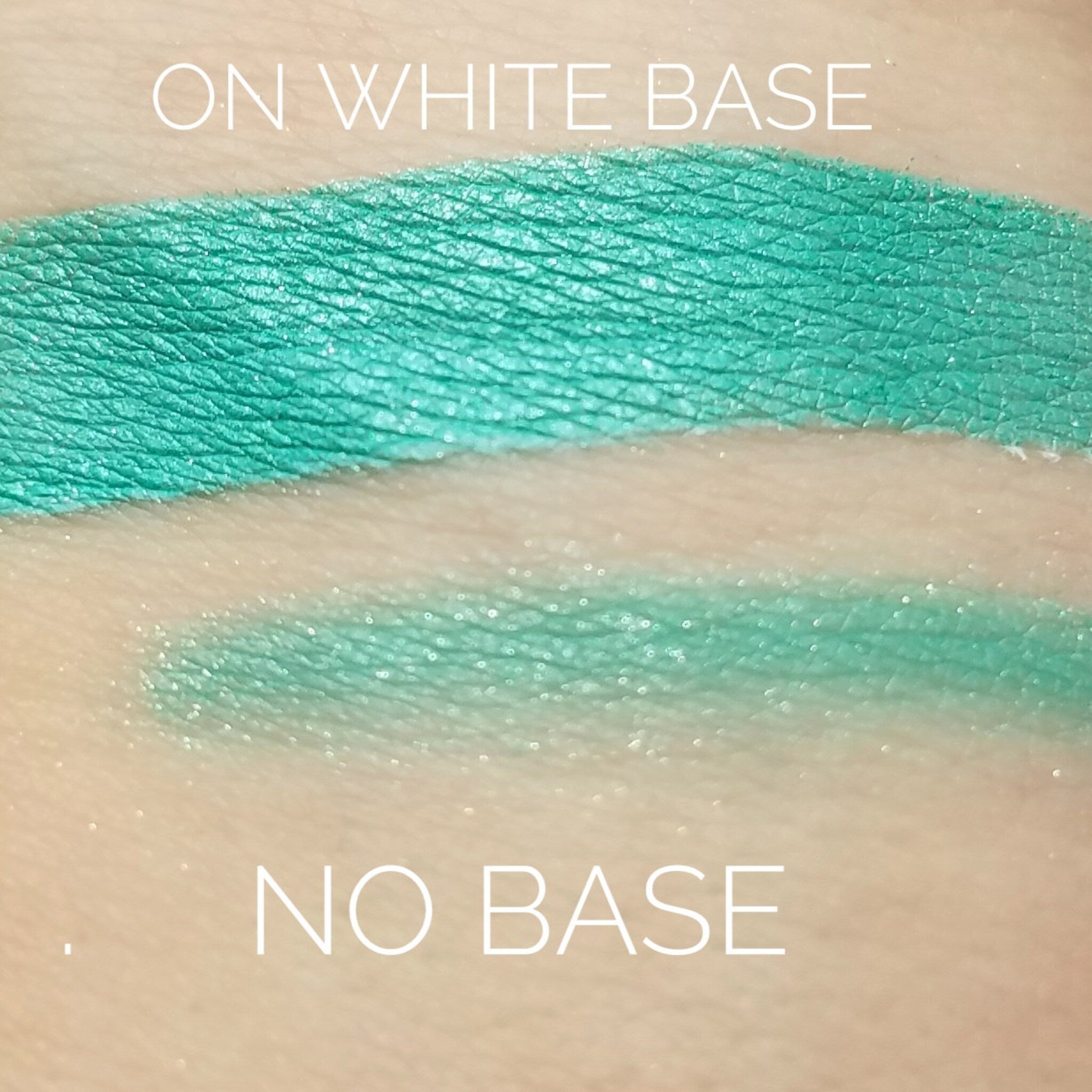 Close-up of shimmering emerald green eye shadow with iridescent flecks in compact case