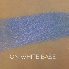 Close-up of shimmering Mystic Eye Shadow palette showing rich violet and silver tones with smooth, blendable texture