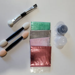 Side view of Cinnamon Kiss Eye Shadow compact showing warm bronze shimmer powder in square pan