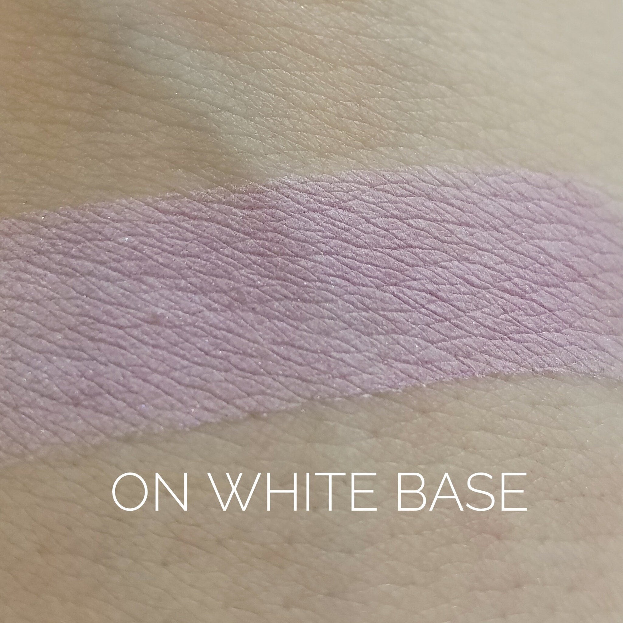 Close-up of Naive Eye Shadow palette showing four matte shades in warm nude tones with smooth, blendable texture