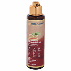Facial cleanser bottle with gold cap, brown and red label, and brand name Roots & Herbs visible