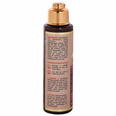 Facial cleanser bottle, brown glass, gold cap, with product information label