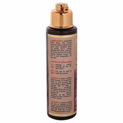 Facial cleanser bottle with gold cap, brown label, and text details