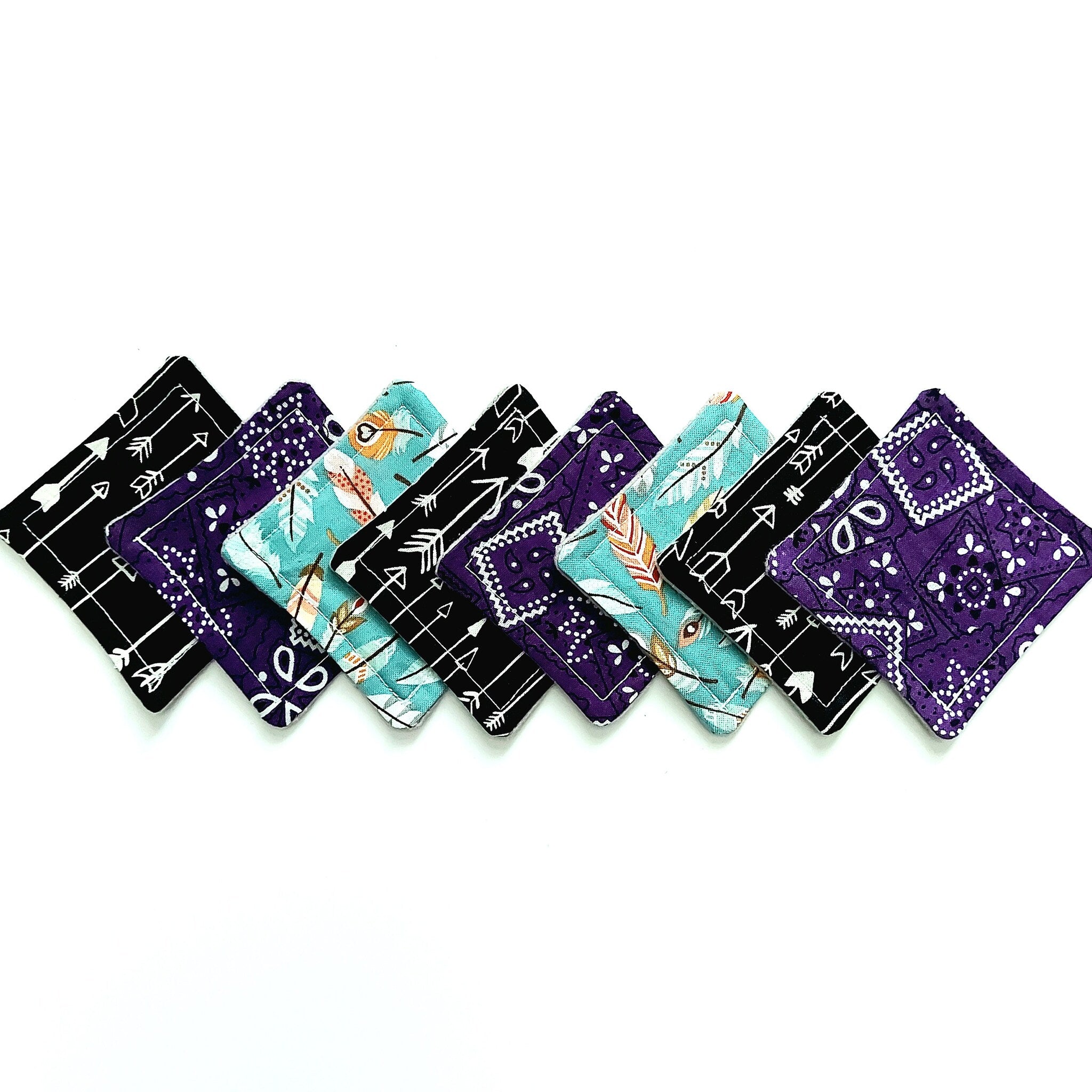 Coasters with black, purple, and teal patterns, various arrow and floral designs, square shape