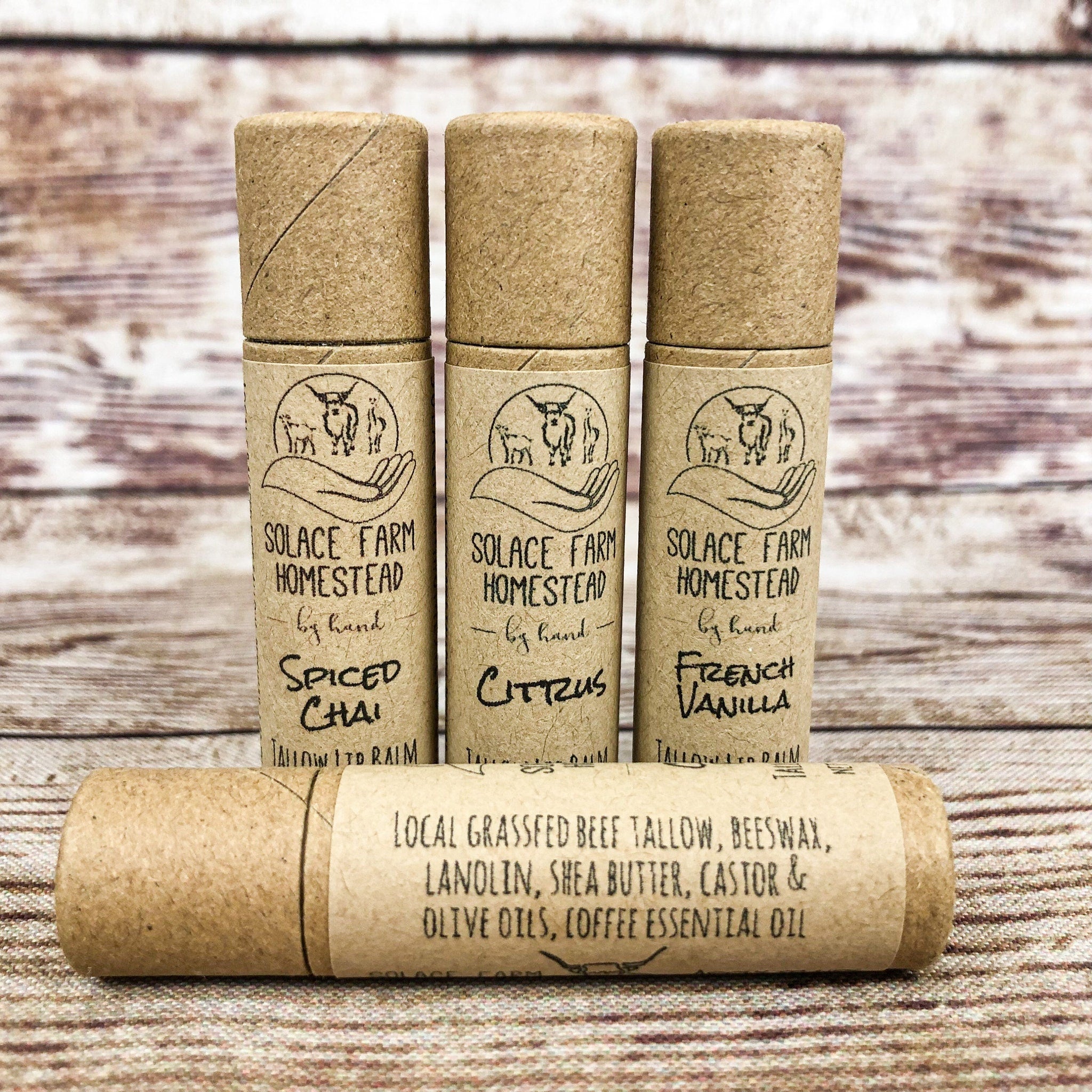 Lip balm tubes in brown paper packaging with brand text and flavor labels on wood surface
