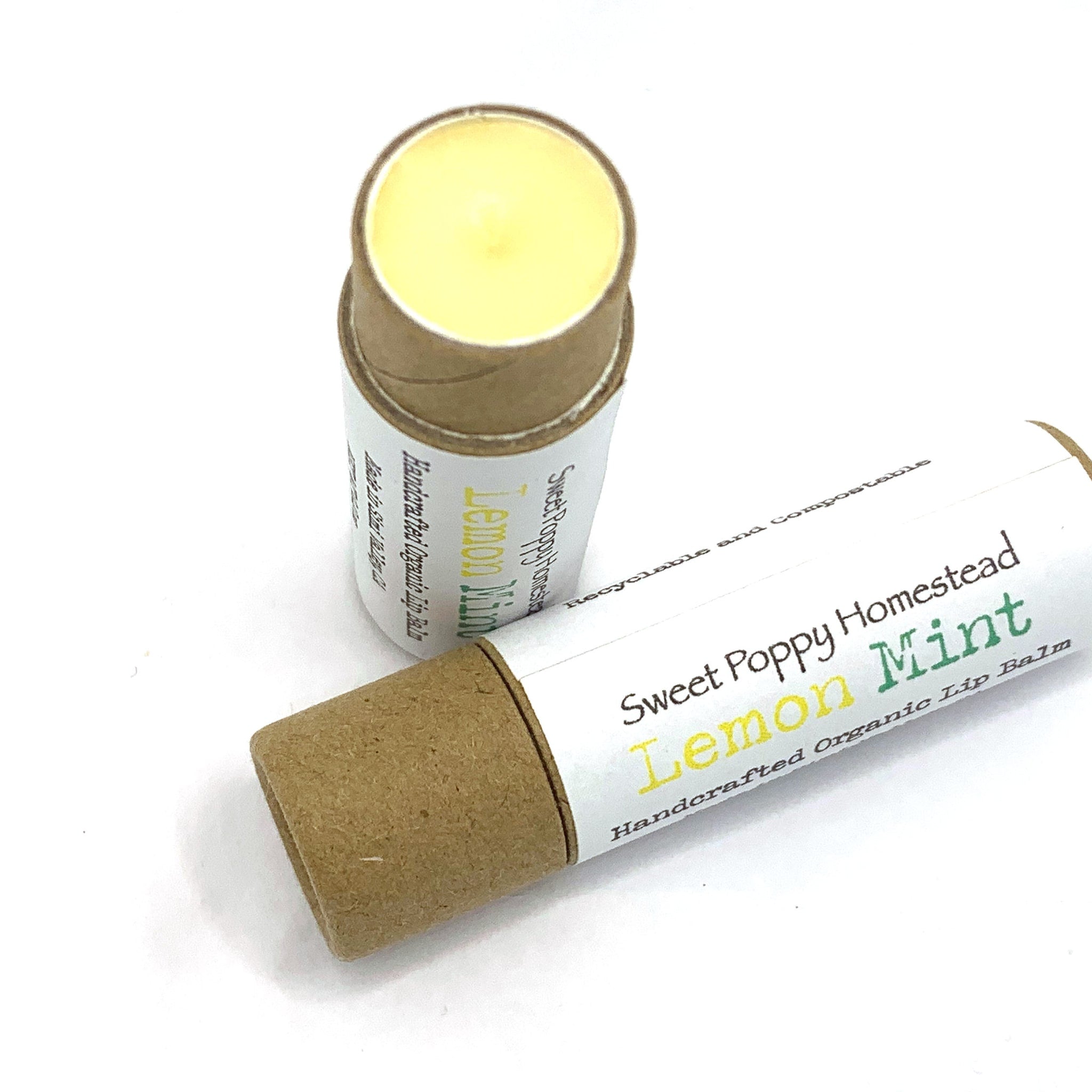 Lip balm tubes with yellow balm, brown cardboard, and Sweet Poppy Homestead label