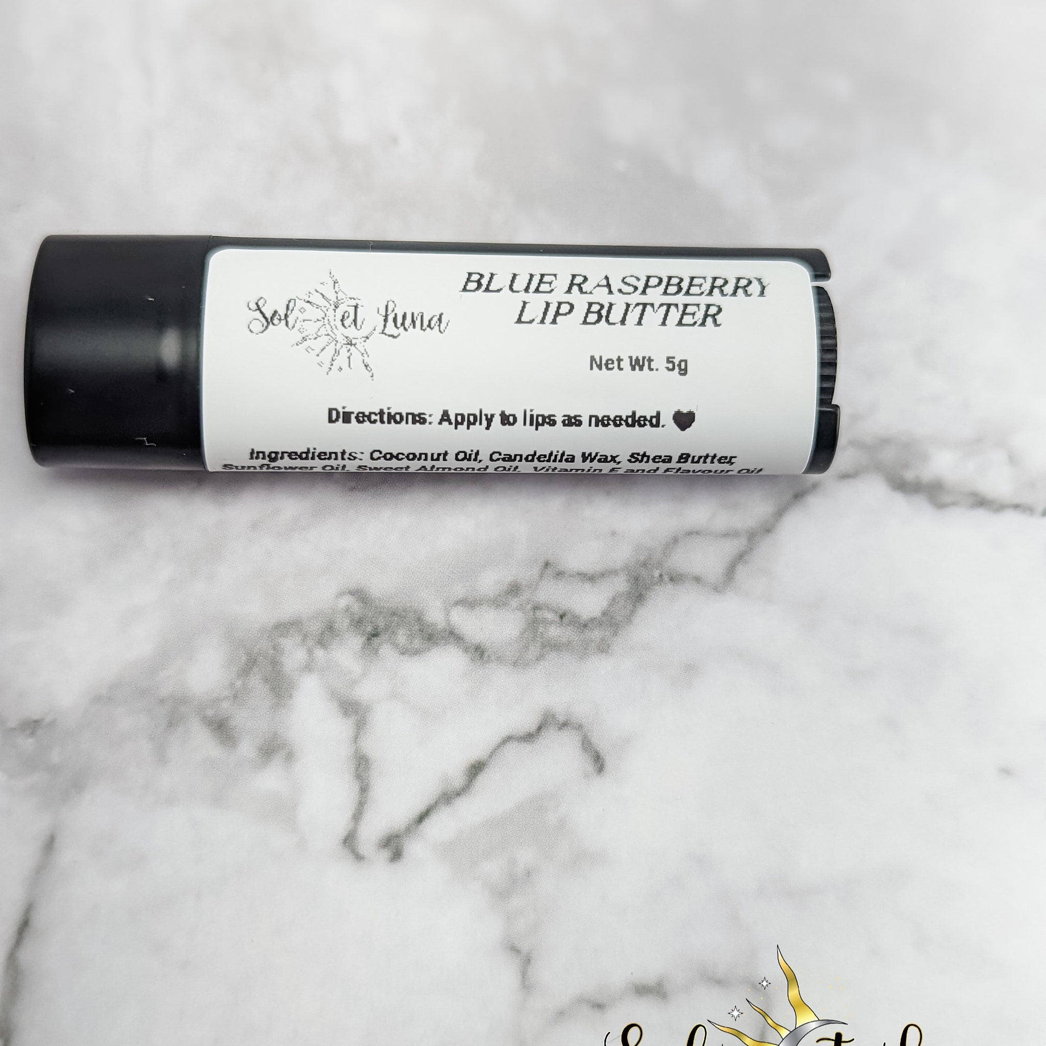 Lip butter tube, black and white label, "SOLETLUNA" branding, for lip application