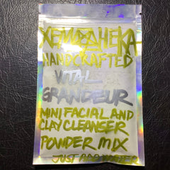 Facial cleanser powder mix in a clear, iridescent pouch with XemHeka text in yellow