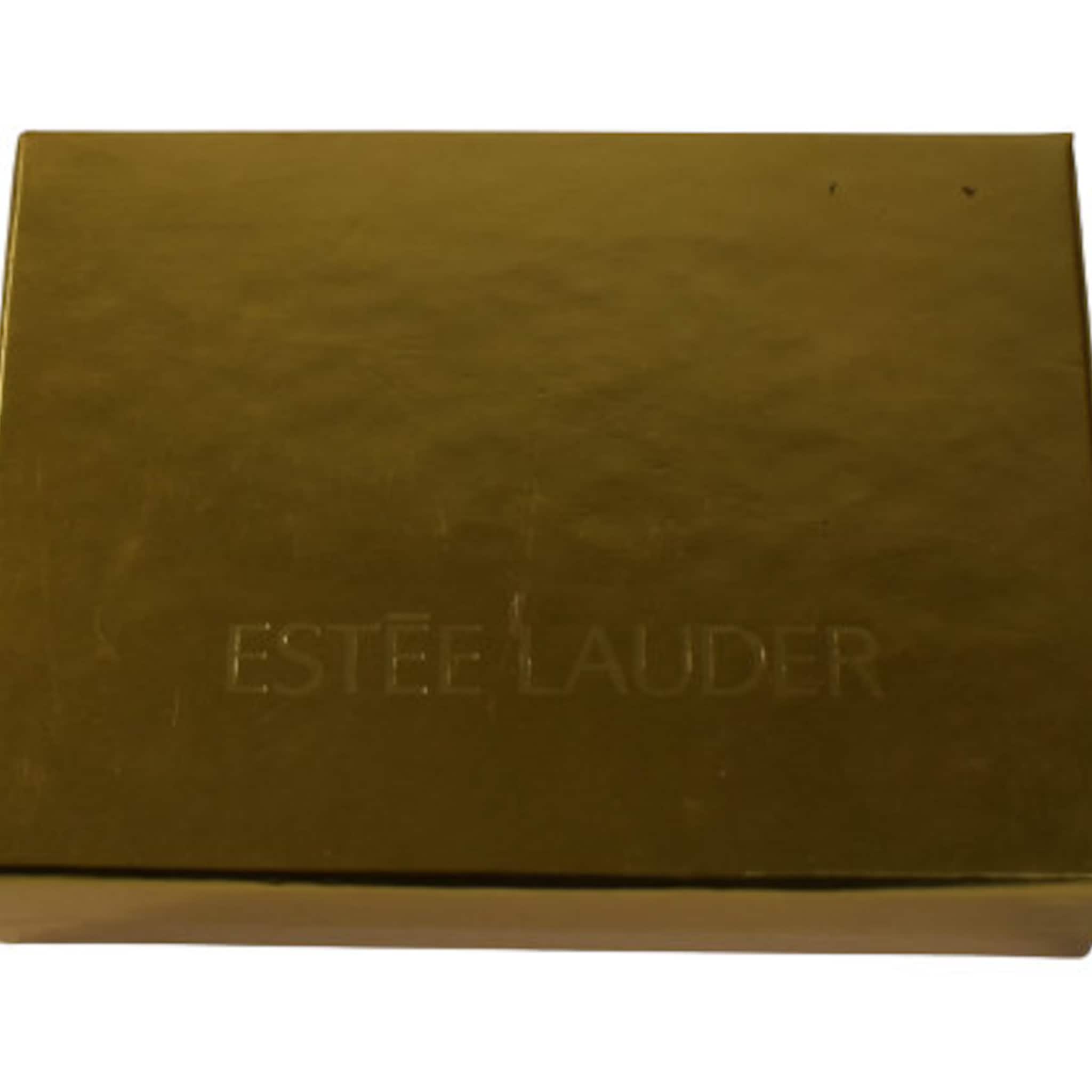 Estee Lauder gold box with embossed brand name and rectangular shape