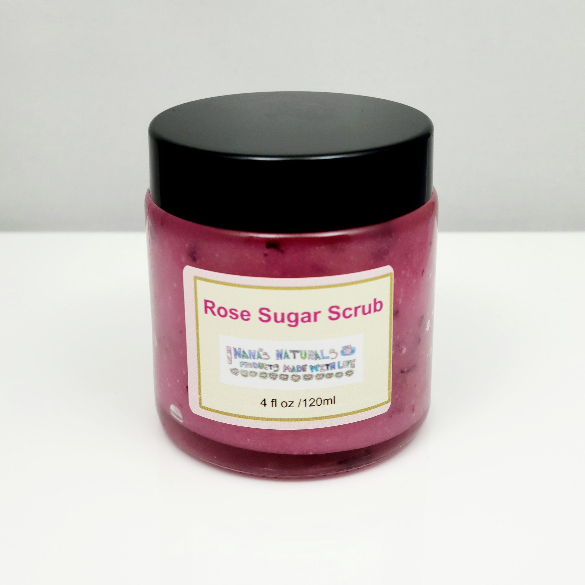 Rose Sugar Scrub jar with pink scrub, black lid, and Nanas Naturals label