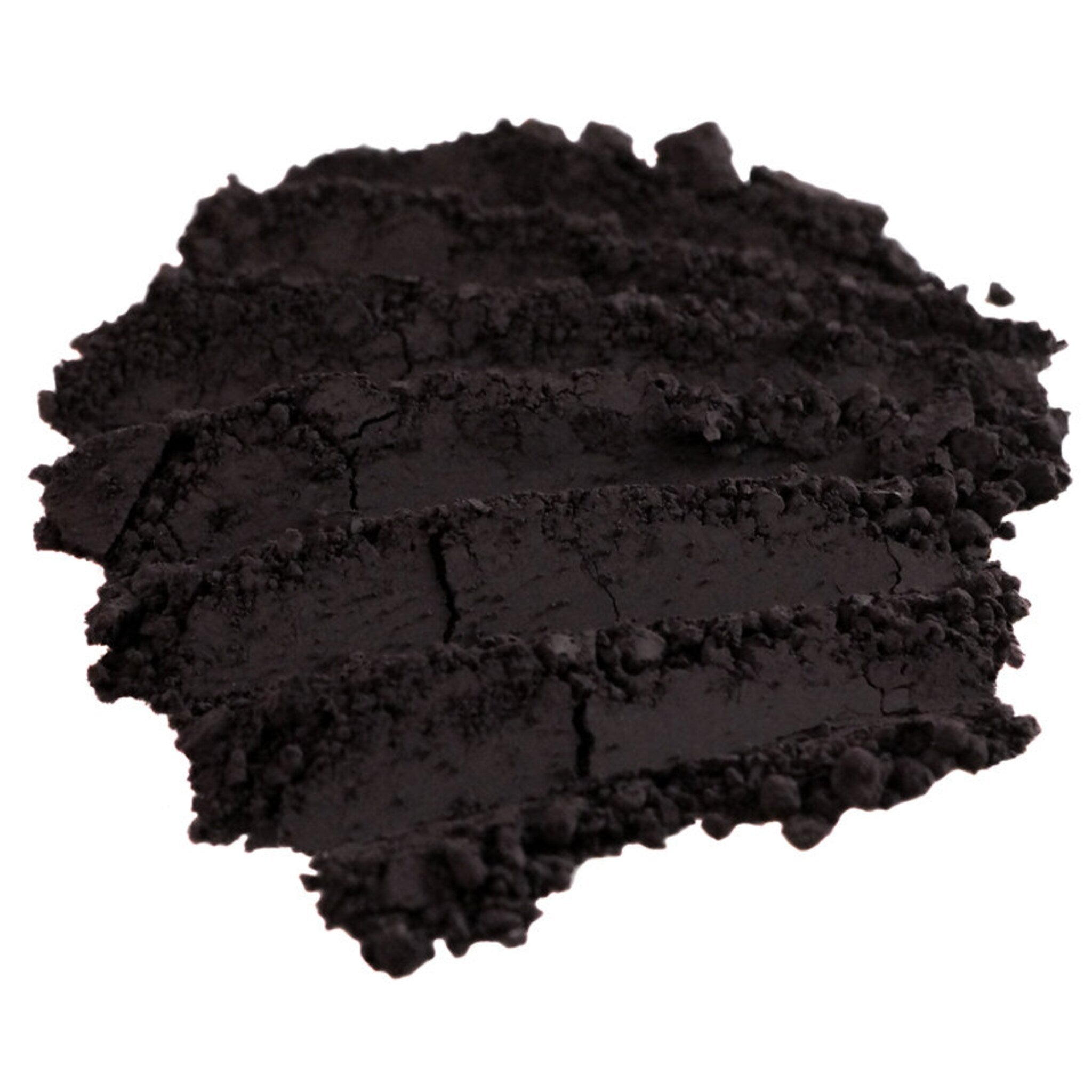 Close-up of matte dark purple loose mineral eyeshadow with rich aubergine pigment in a jar