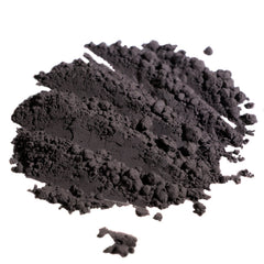Dark gray powder with textured appearance and small particles on white background