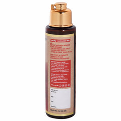 Bottle of brown liquid with gold cap and label, for oily combination skin