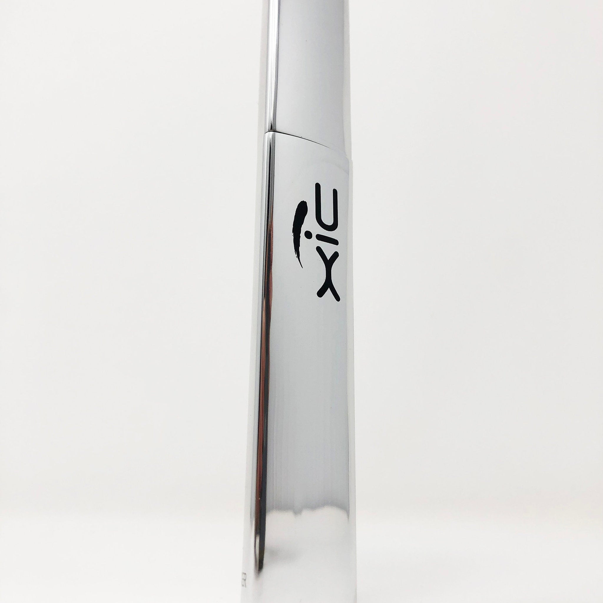 Metallic silver bottle with black logo on white background.