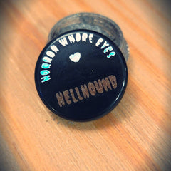 Close-up of Hellhound loose eye shadow pigments showing rich metallic bronze shimmer and fine powder texture