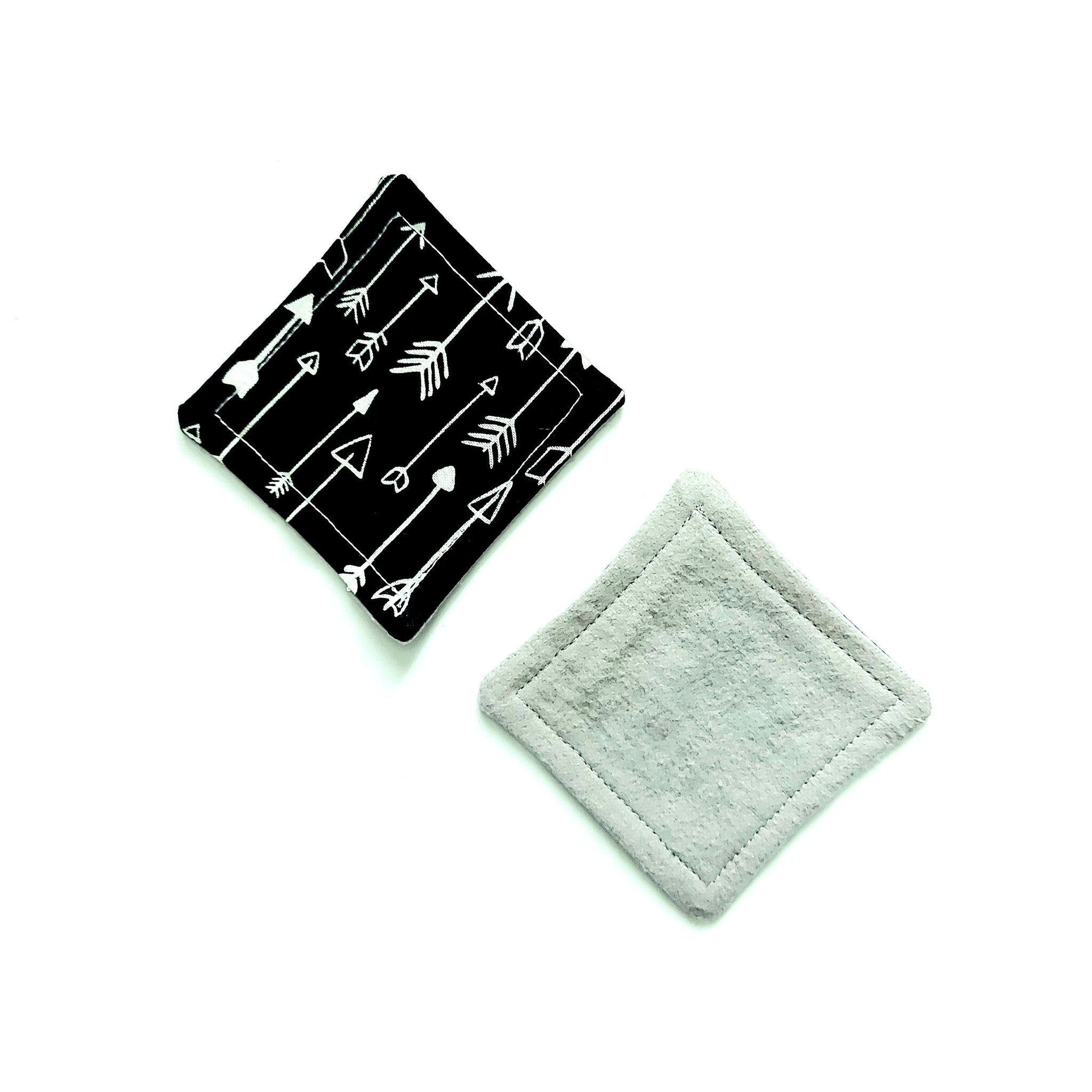 Reusable face pads, black arrow print with gray backing, square shape