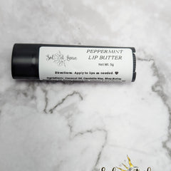 Lip butter tube with black casing, white label, and SOLETLUNA text, for lip care