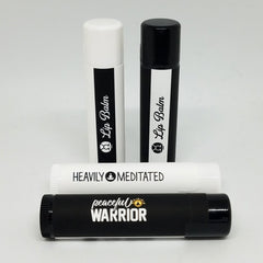 Lip balm tubes in black and white with text "Lip Balm" and "peaceful WARRIOR" displayed