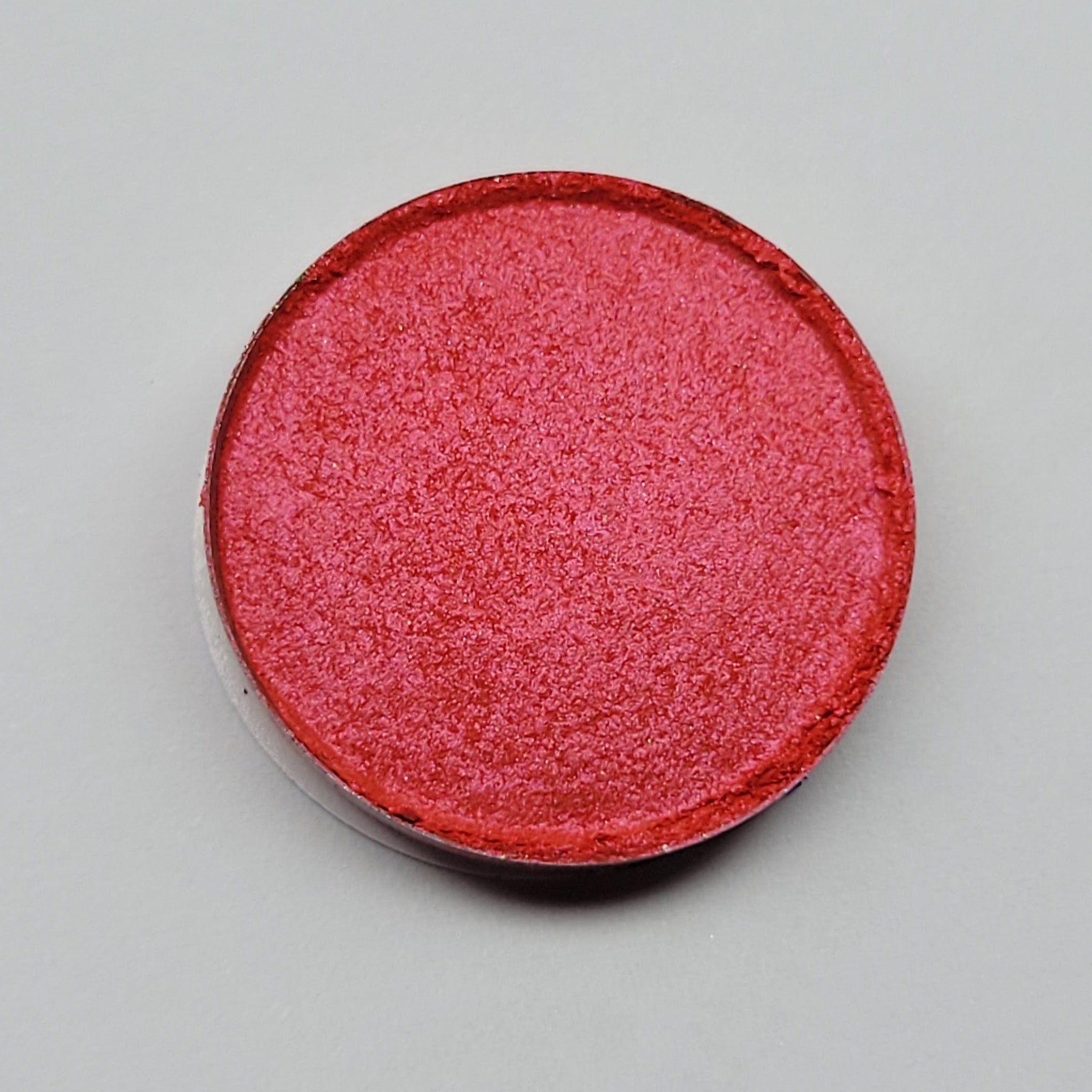 Close-up of Gracidea hot pink and red eyeshadow palette with vibrant matte finish