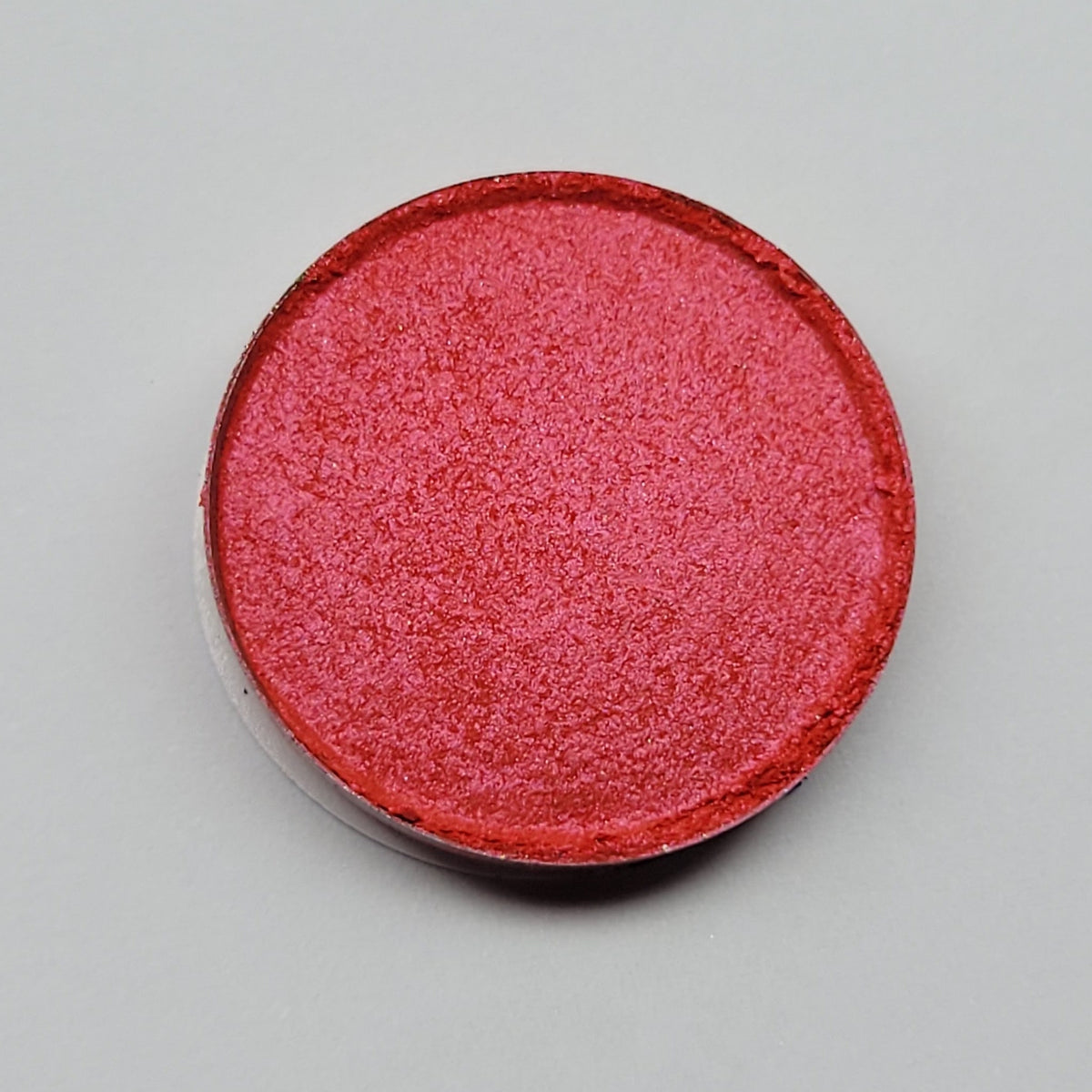 Close-up of Gracidea hot pink and red eyeshadow palette with vibrant matte finish