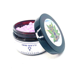 Sugar scrub jar with pink scrub, black lid, and Glow Berry label