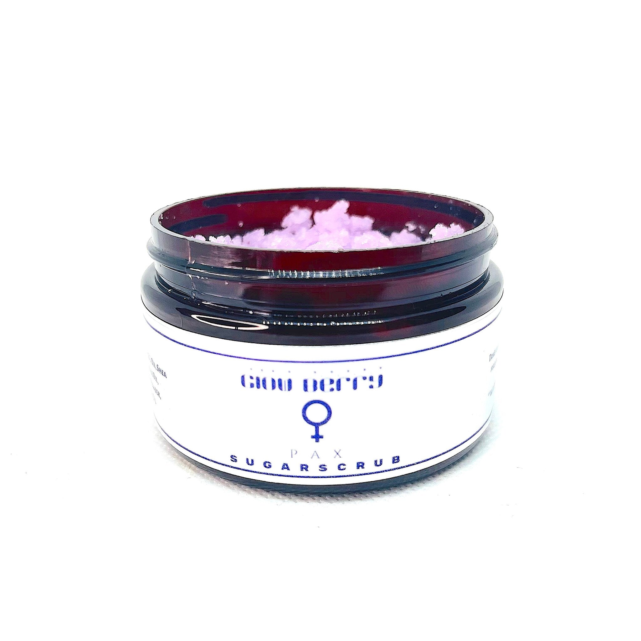 Sugar scrub jar with pink scrub, brown glass, and white label with text PAX SUGAR SCRUB