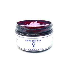Sugar scrub jar with pink scrub, brown glass, and white label with text PAX SUGAR SCRUB