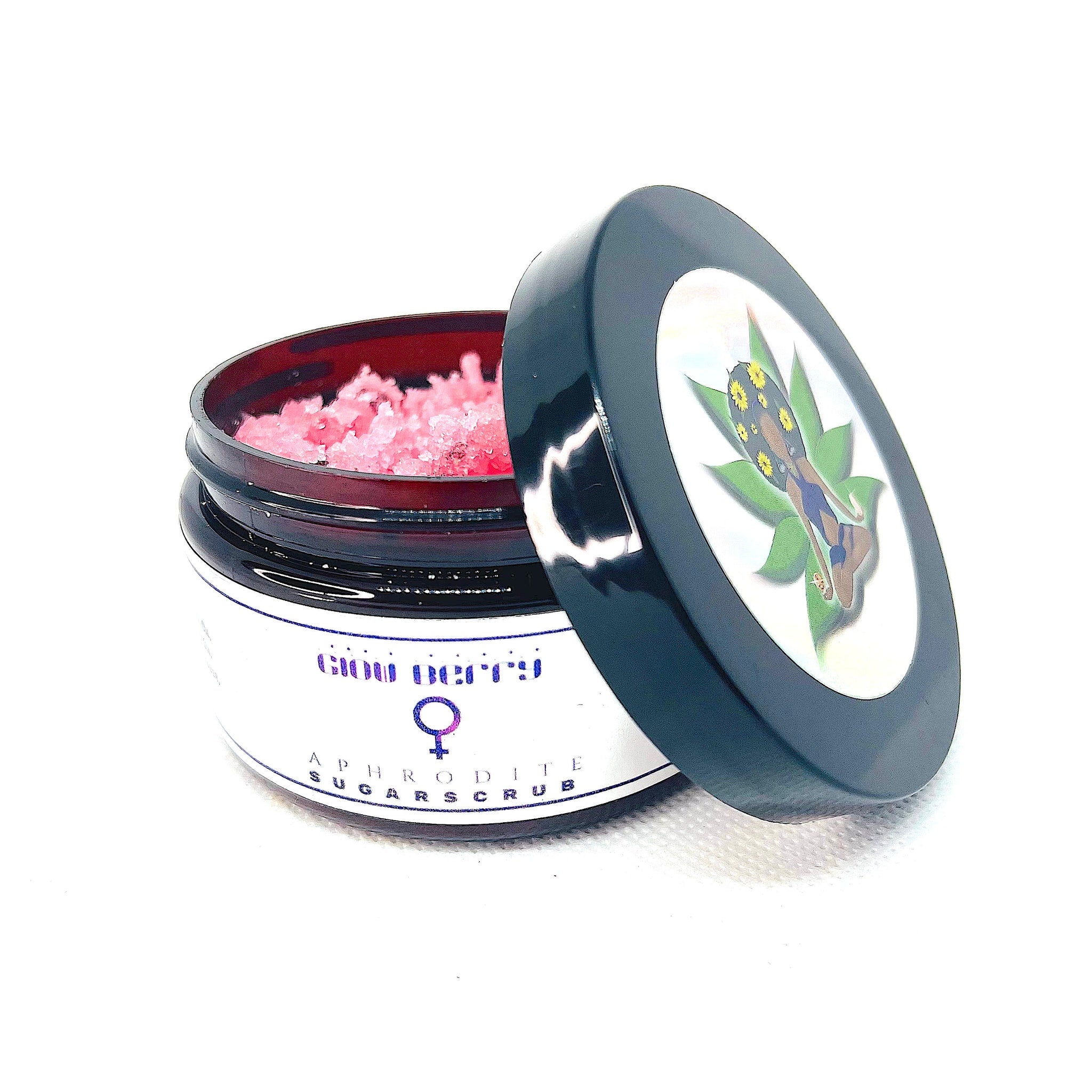 Sugar scrub jar with pink scrub, black lid, and white label with Glow Berry text