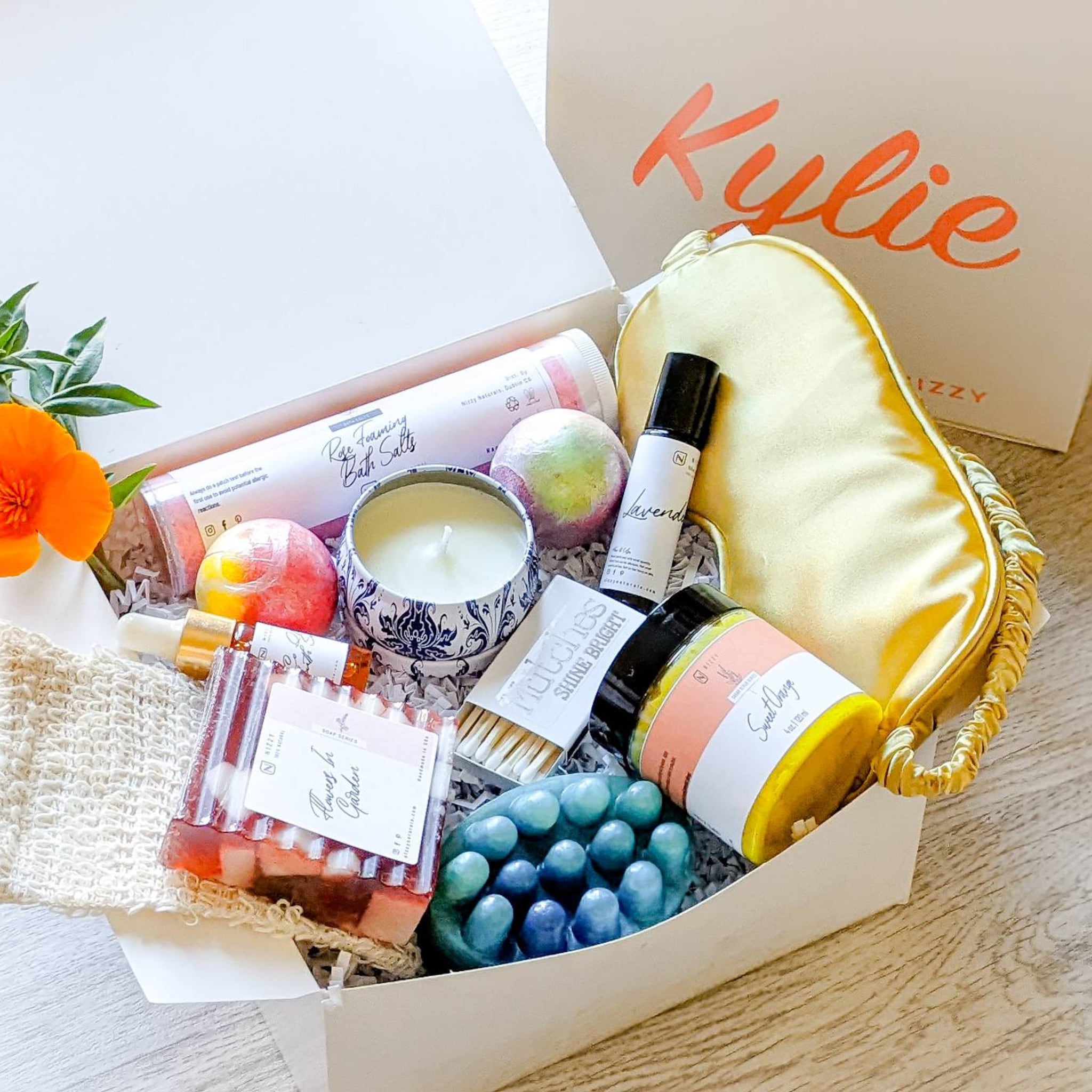 Spa Gift Set with white box, gold eye mask, and Nizzy Naturals products inside