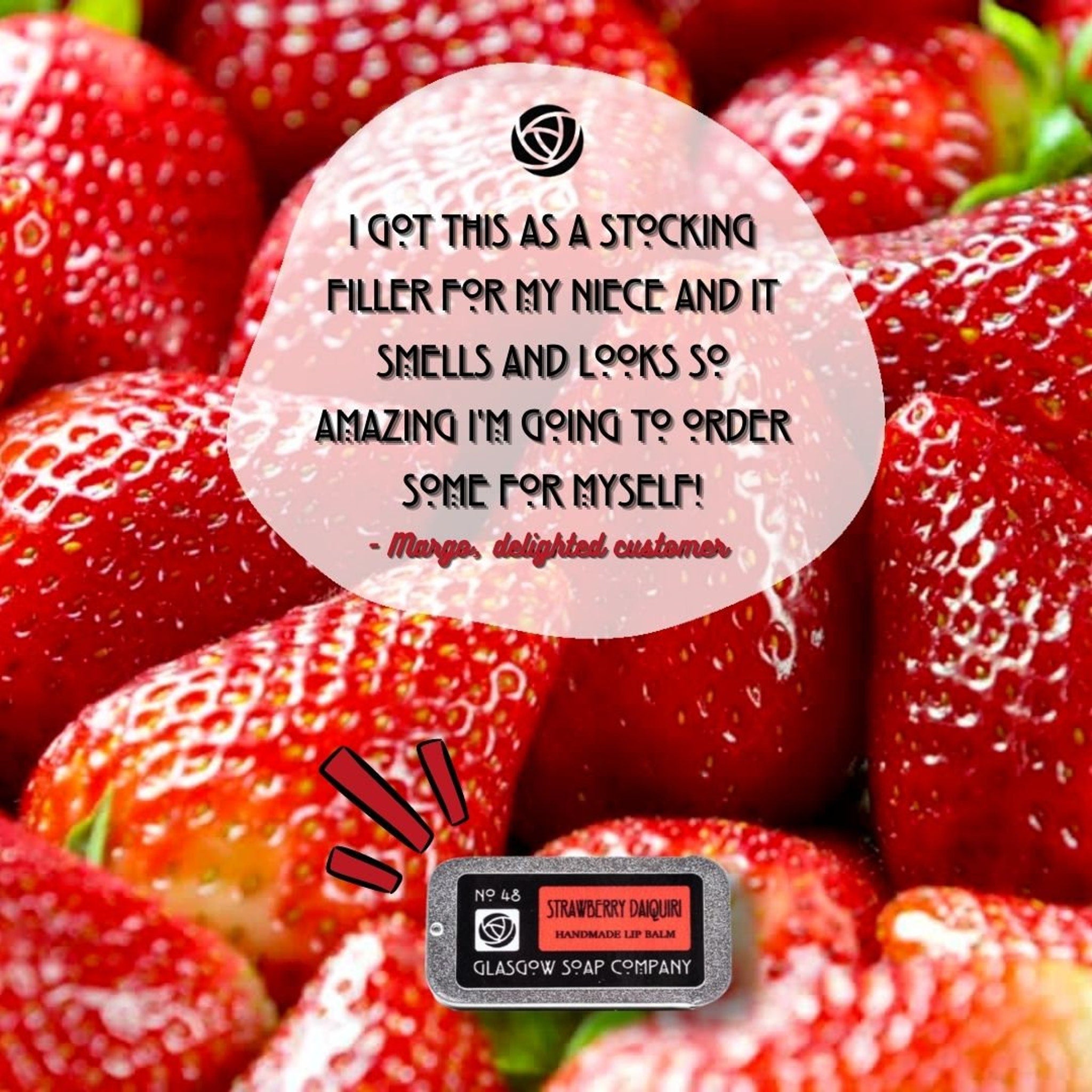 Strawberry Daiquiri lip balm with red label, silver case, and Glasgow Soap Company text, in strawberry context