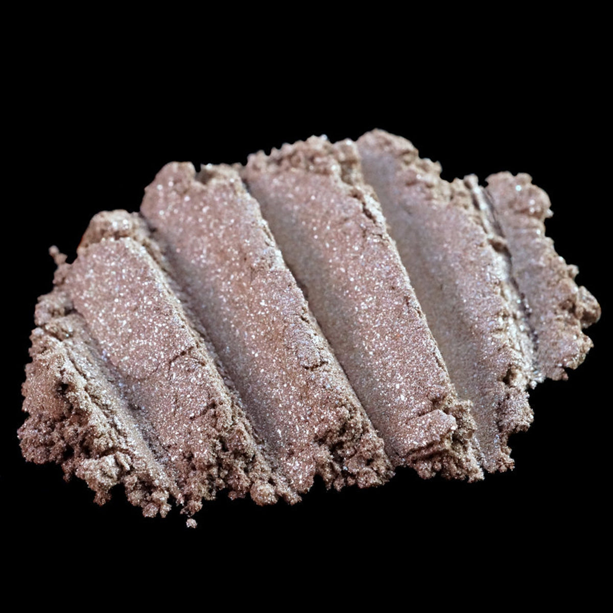 Metallic taupe and champagne loose pigment eyeshadow with silver shimmer in a clear jar