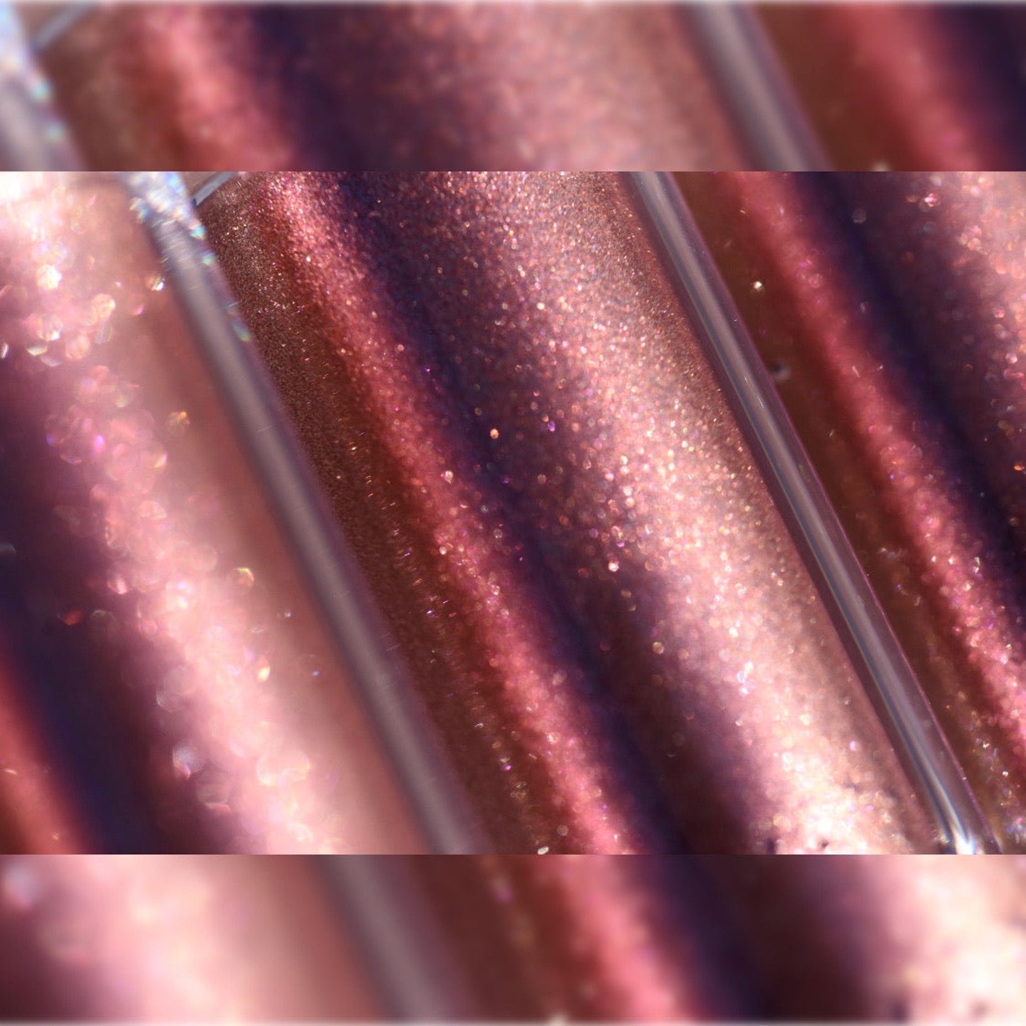Close-up of shimmering molten shadow in deep emerald green with diamond sparkle particles