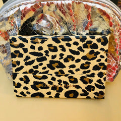 Elizabeth Arden leopard-print eyeshadow palette with 12 ombré shades and mirror inside a sleek black case