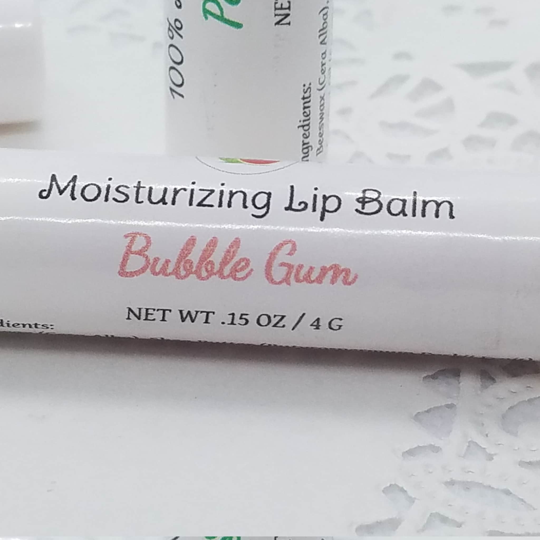 Moisturizing Lip Balm with Bubble Gum text, white tube with pink text, Mellen Patch Soaps product