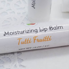 Moisturizing Lip Balm, white tube with black and orange text, Tutti Frutti flavor
