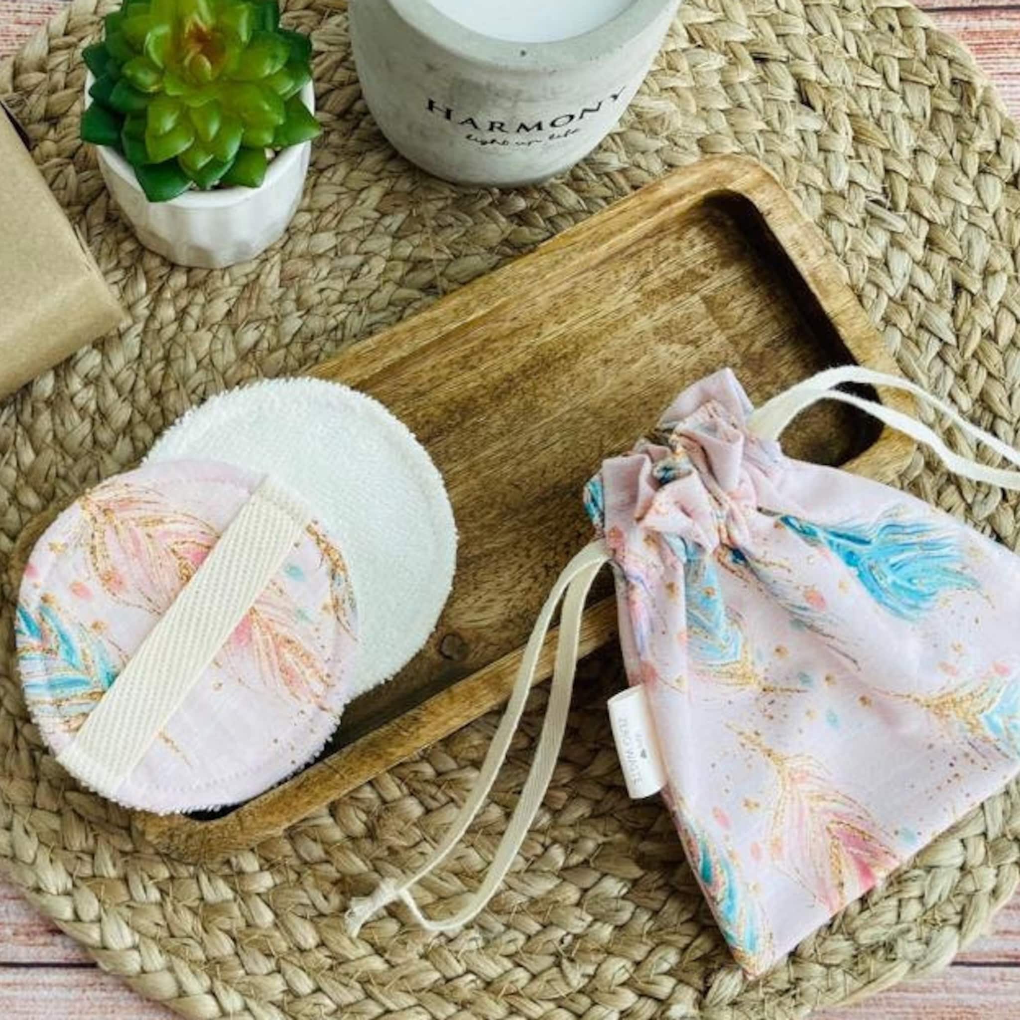 Reusable face wipes, white and pink patterned, with drawstring bag