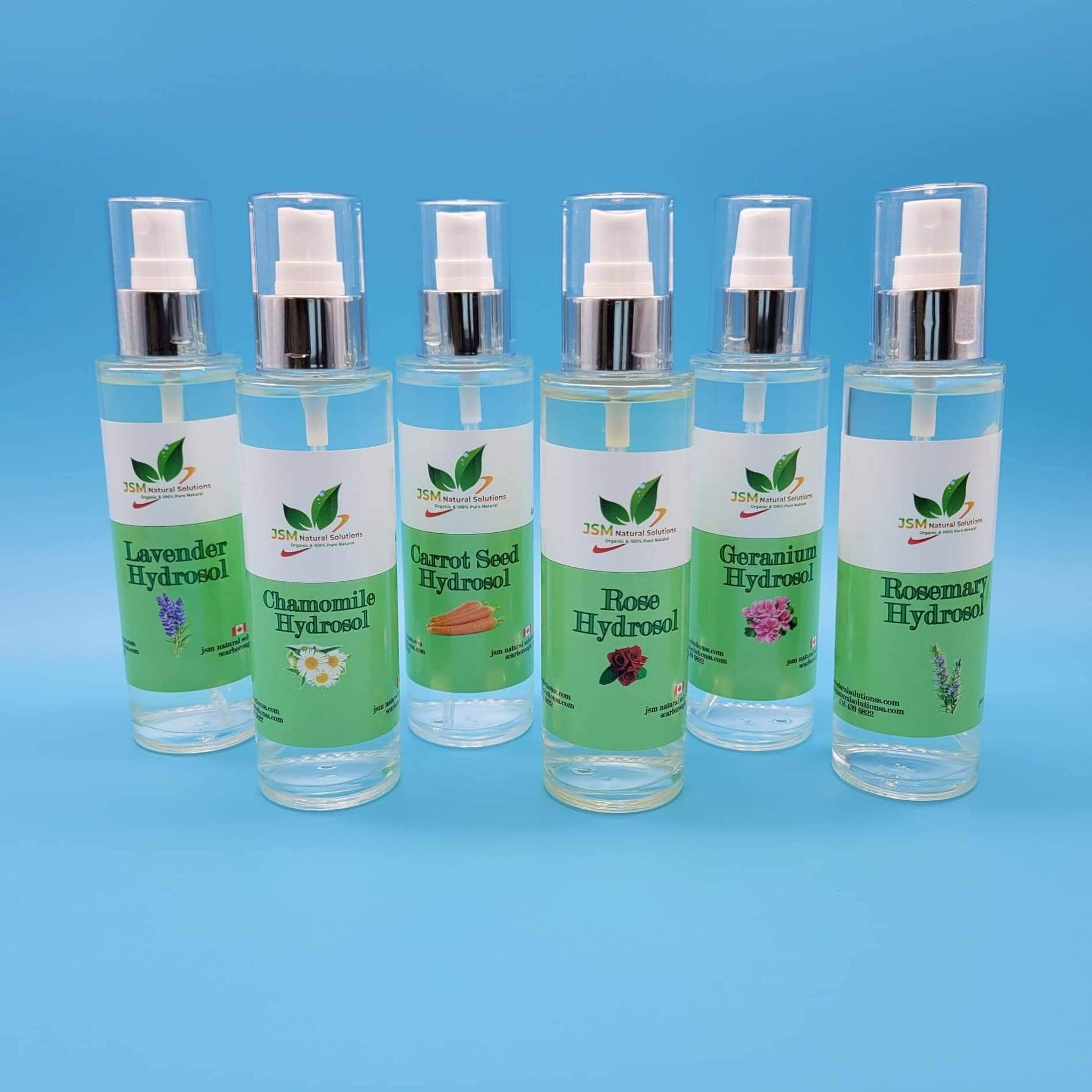 Hydrosol bottles with clear glass, silver pump tops, and green labels, JSM Natural Solutions brand