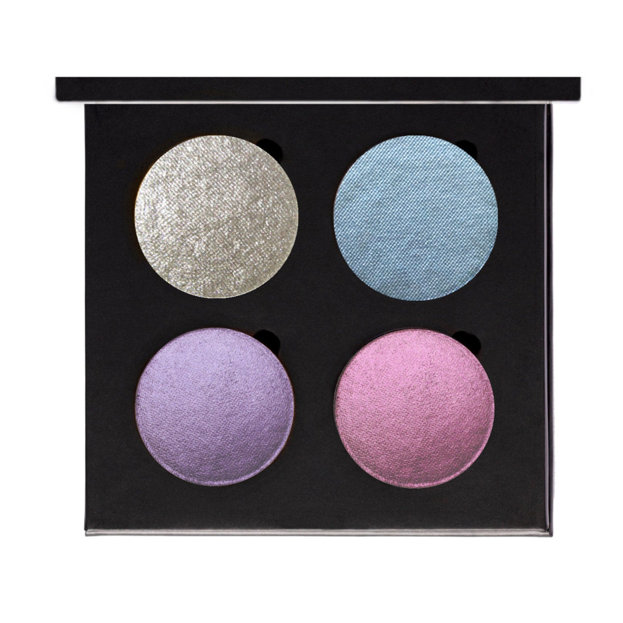 Clean Vegan eyeshadow compact with mirrored lid and embossed logo, shown open on marble surface