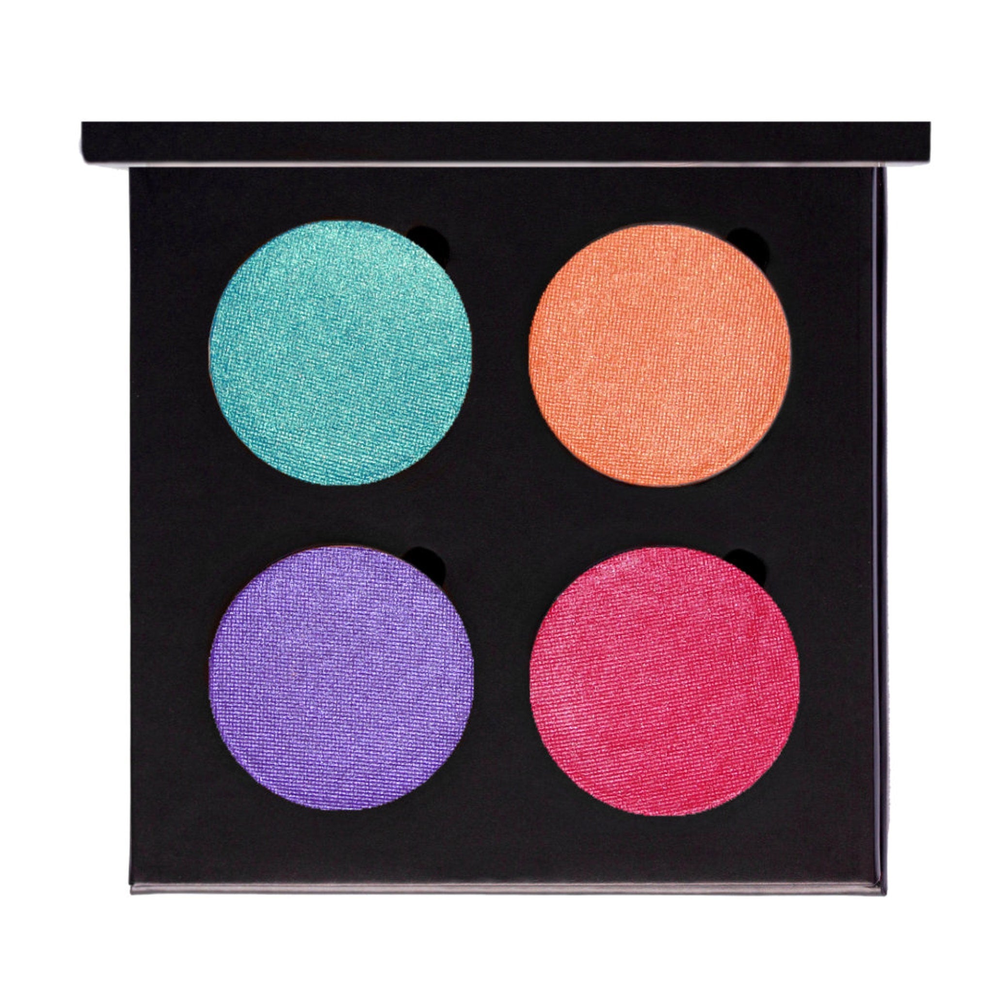 Close-up of creamy vegan eyeshadow pan showing rich pigmentation and smooth satin finish