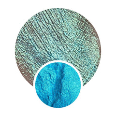 Close-up of chameleon moonshifter loose pigment in a jar showing multichrome shift from gold to pink.