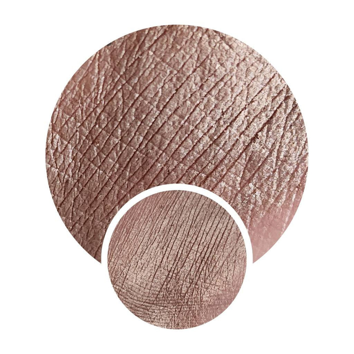 Close-up of Coco Bronze Beige Brown duochrome eyeshadow with metallic sheen in compact case