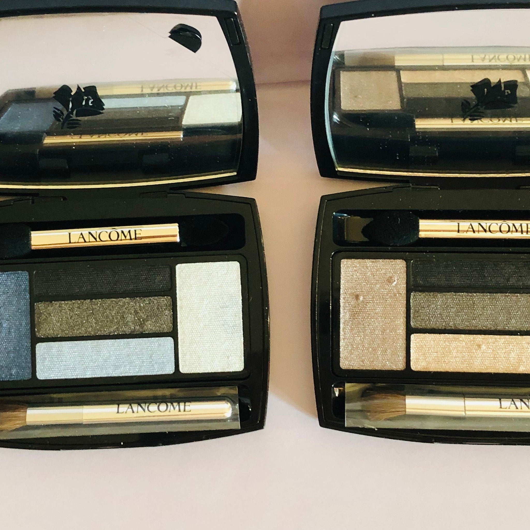 Side view of LANCÔME x Alber Elbaz taupe eyeshadow palette showing sleek black compact with gold detailing