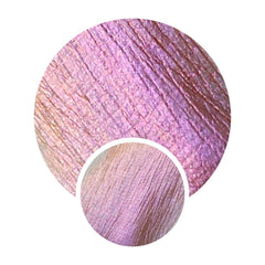 Pressed multichrome eyeshadow pan shifting from dark orange to pink with intense shimmer finish