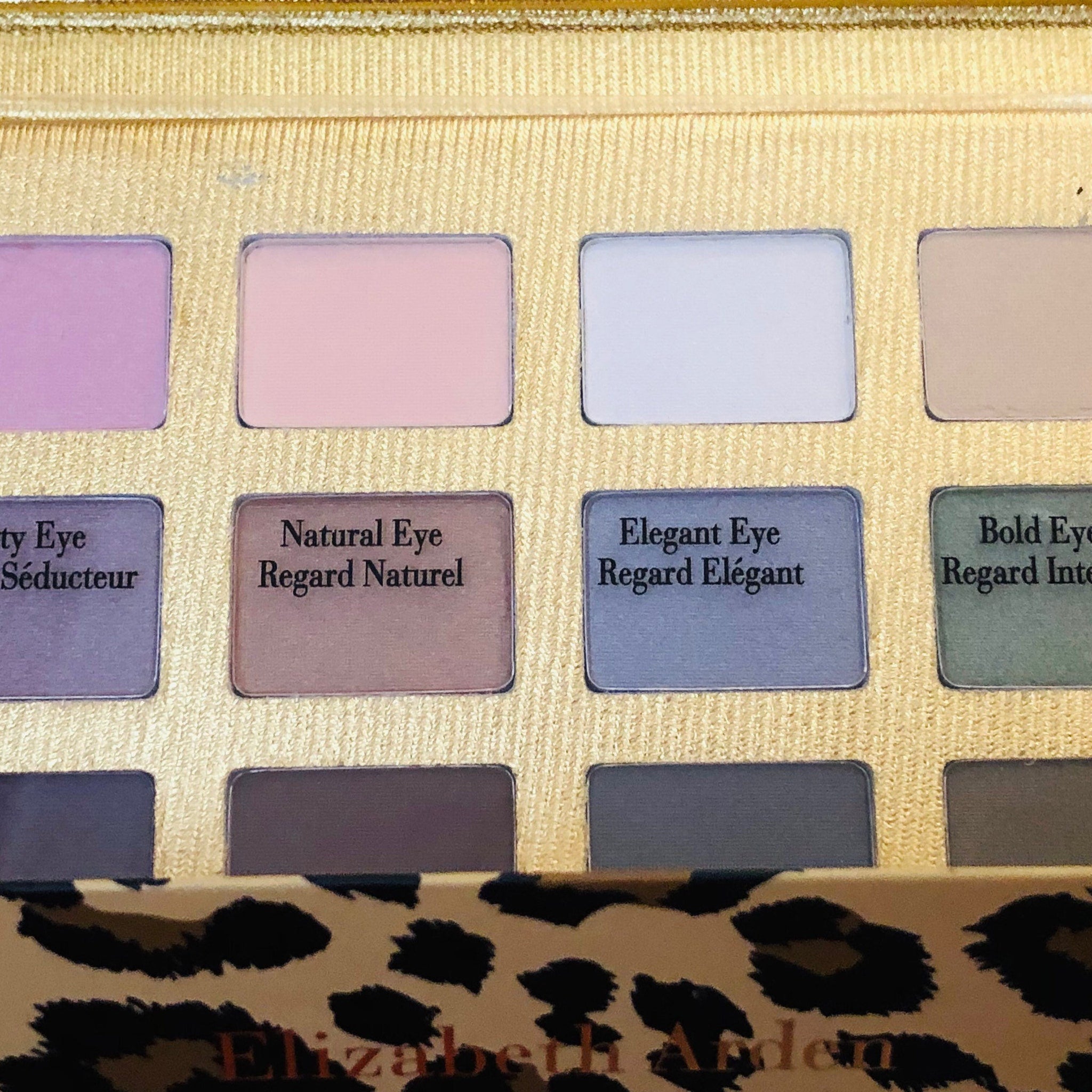 Detailed close-up of Elizabeth Arden Ombré 12 Eyeshadow Palette with Leopard Case  Mirror  Free Silve