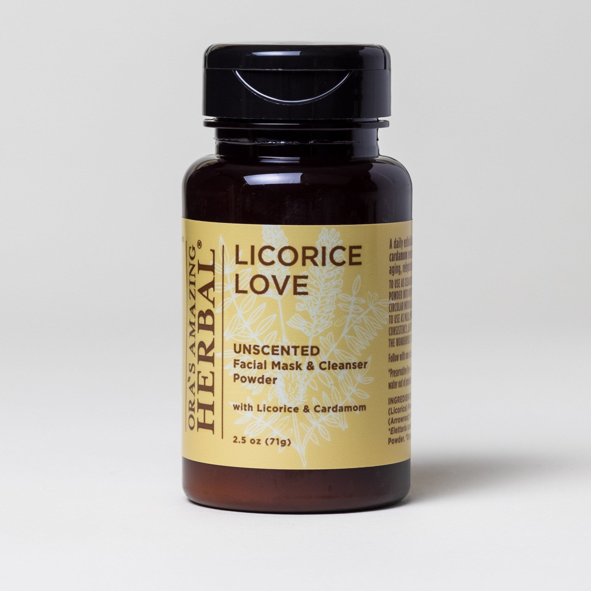 Facial mask powder bottle, brown glass, black cap, yellow label with text and botanical illustration