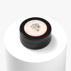 Close-up of matte red eye shadow palette showing warm apple and deep rusty shades with smooth powder texture