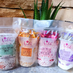 Bath salts in clear plastic bags, various colors, with ameelahessentials branding