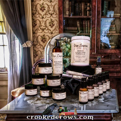 Skincare products in various brown bottles and jars, with "Maga Longerium" labels, arranged on a marble surface