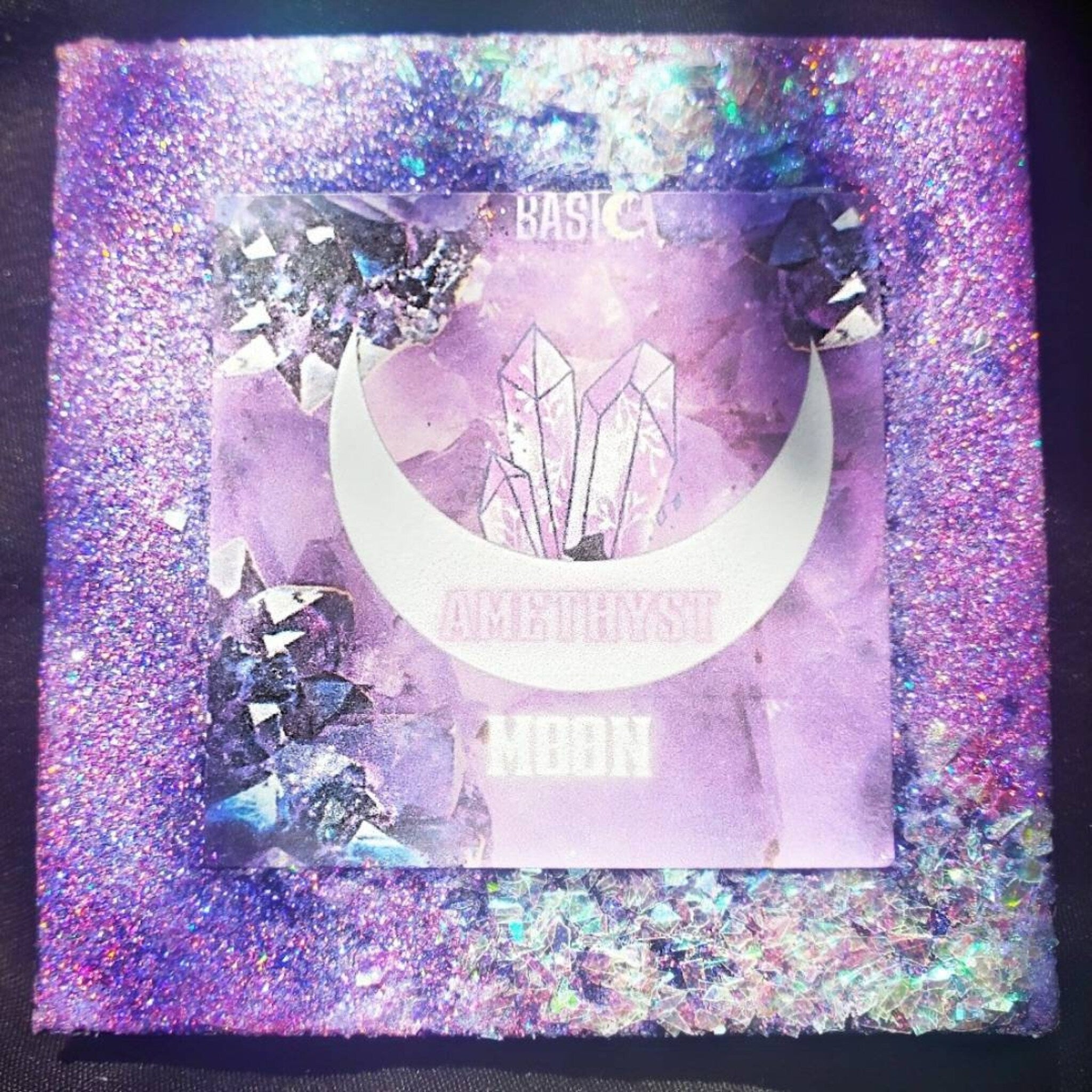 Amethyst Moon palette open with 2 matte purples and 1 shimmer glitter shade arranged in circular pans
